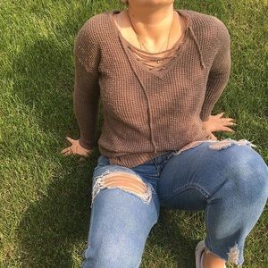 brown, cross tie neck sweater.